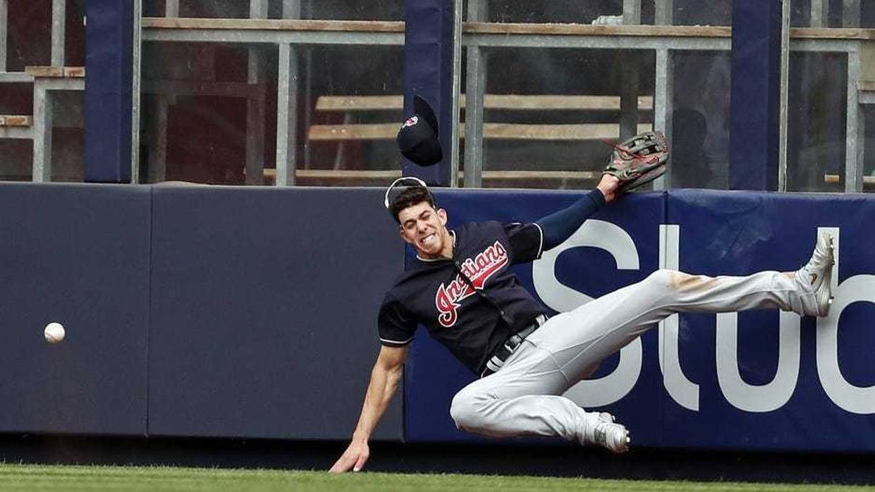 May 5, 2018; Bronx, NY, USA; Cleveland Indians center fielder Bradley Zimmer (4) collides with the wall attempting to catch a double by New York Yankees catcher Austin Romine (28) during the seventh inning at Yankee Stadium. Mandatory Credit: Adam Hunger-