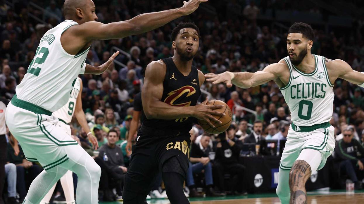 May 7, 2024; Boston, Massachusetts, USA; Cleveland Cavaliers guard Donovan Mitchell (45) tries to get between Boston Celtics forward Jayson Tatum (0) and Al Horford (42) during the first quarter of game one of the second round of the 2024 NBA playoffs at TD Garden. Mandatory Credit: Winslow Townson-USA TODAY Sports