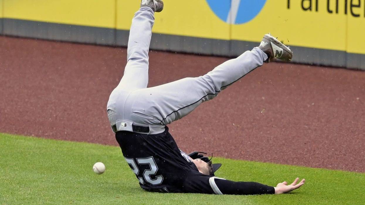 May 9, 2019; Cleveland, OH, USA; Chicago White Sox right fielder Charlie Tilson (22) loses his balance while reaching for a double by Cleveland Indians shortstop Francisco Lindor (not pictured) in the fifth inning at Progressive Field.