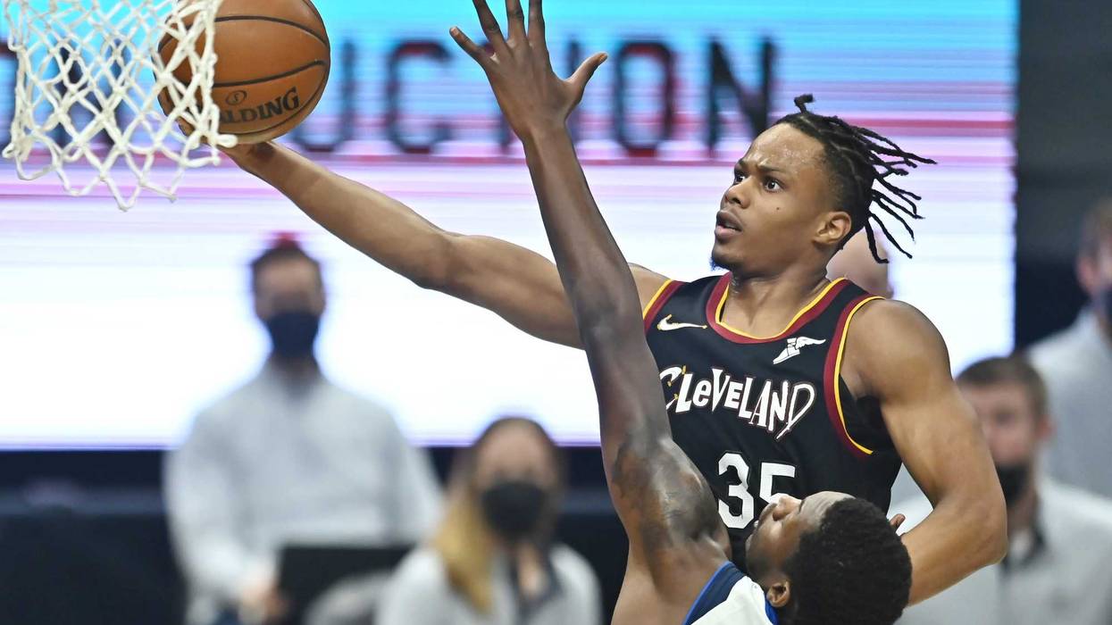 May 9, 2021; Cleveland, Ohio, USA; Cleveland Cavaliers forward Isaac Okoro (35) drives to the basket against Dallas Mavericks forward Dorian Finney-Smith (10) during the first quarter at Rocket Mortgage FieldHouse.