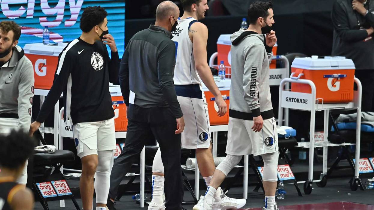 May 9, 2021; Cleveland, Ohio, USA; Dallas Mavericks guard Luka Doncic (77) is escorted off the floor after being ejected during the third quarter against the Cleveland Cavaliers at Rocket Mortgage FieldHouse.