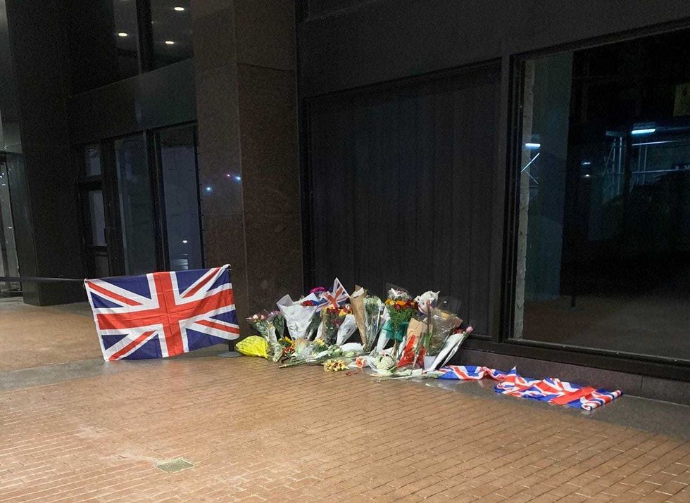 Mayor Adams and other New Yorkers laid flowers outside the British Consulate at Hammarskjold Plaza in Turtle Bay on Friday