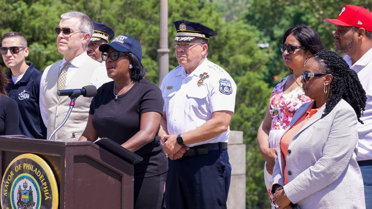 Mayor Cherelle Parker (podium), Police Commissioner Kevin Bethel (behind) and other city officials hold a press conference on July 3, 2025, assuring that Fourth of July celebrations will go on safely amid the city workers strike.