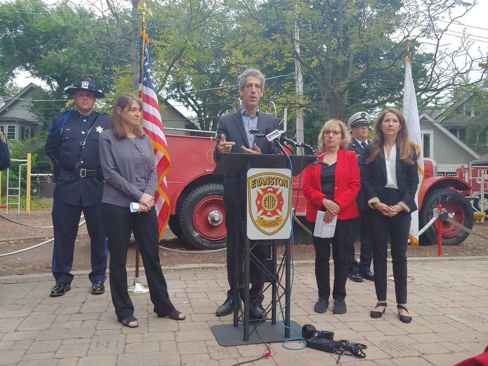 Mayor Daniel Biss speaks at an Evanston Fire Department podium