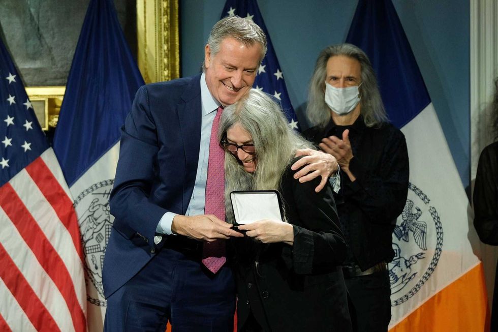 Mayor de Blasio presents Patti Smith with the key to the city on Monday