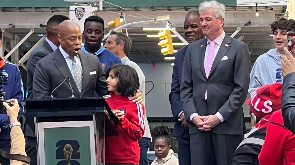 Mayor Eric Adams and New Jersey Gov. Phil Murphy with a young soccer fan at Thursday's FIFA 2026 kickoff.
