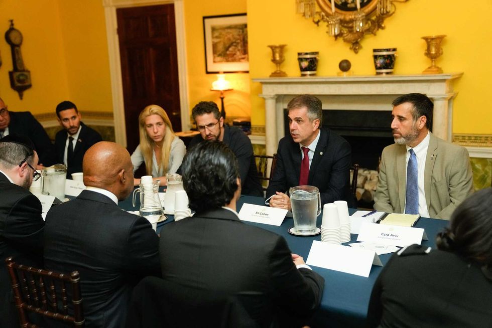 Mayor Eric Adams sits across from Israeli Minister of Foreign Affairs Eli Cohen at Gracie Masion on Oct. 24, 2023. Families of hostages of the Oct. 7 terrorist attack and other officials joined the pair.