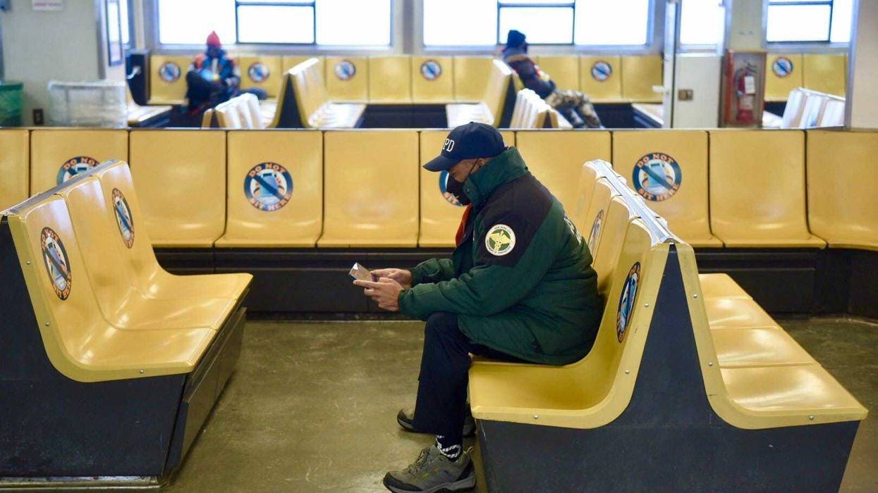 Mayor Eric Adams works while riding the Staten Island Ferry