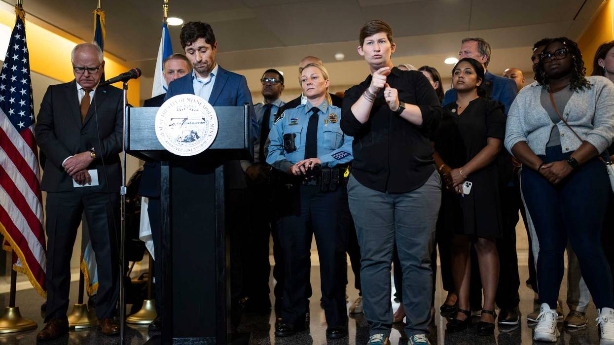 Mayor Jacob Frey, at podium, speaks at a news conference following a fatal shooting, in Minneapolis, Thursday, May, 30, 2024. Minneapolis police Officer Jamal Mitchell was among those killed.