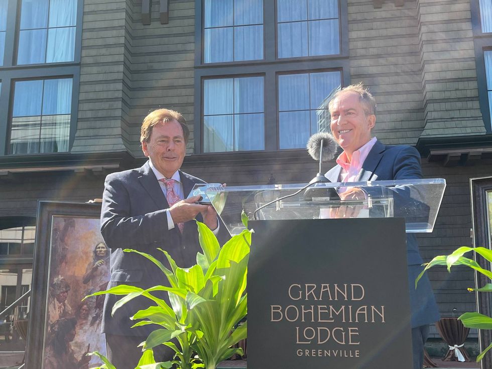 Mayor Knox White (Right) gifts Kessler Collection CEO Richard Kessler (Right) with a commemorative key to the city