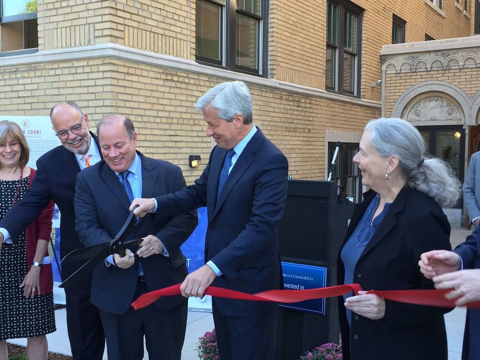 Mayor Mike Duggan is joined by JPMorgan Chase CEO Jamie Dimon (center) and Midtown Detroit Inc.
