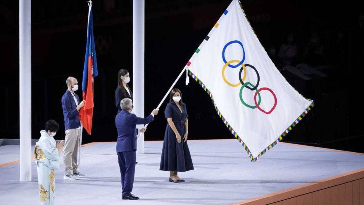 Mayor of Paris, Anne Hidalgo receives the olympic flag from President of the International Olympic Committee, Thomas Bach during the Closing Ceremony of the Tokyo 2020 Olympic Games at Olympic Stadium on August 08, 2021 in Tokyo, Japan.