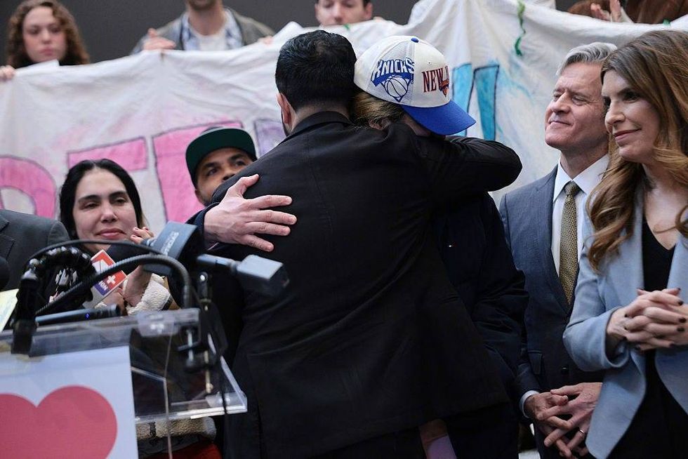 Mayor Zohran Mamdani hugs NYC High School student Dylan Lopez Contreras during a press conference at Middle Church on March 19, 2026 in New York City.