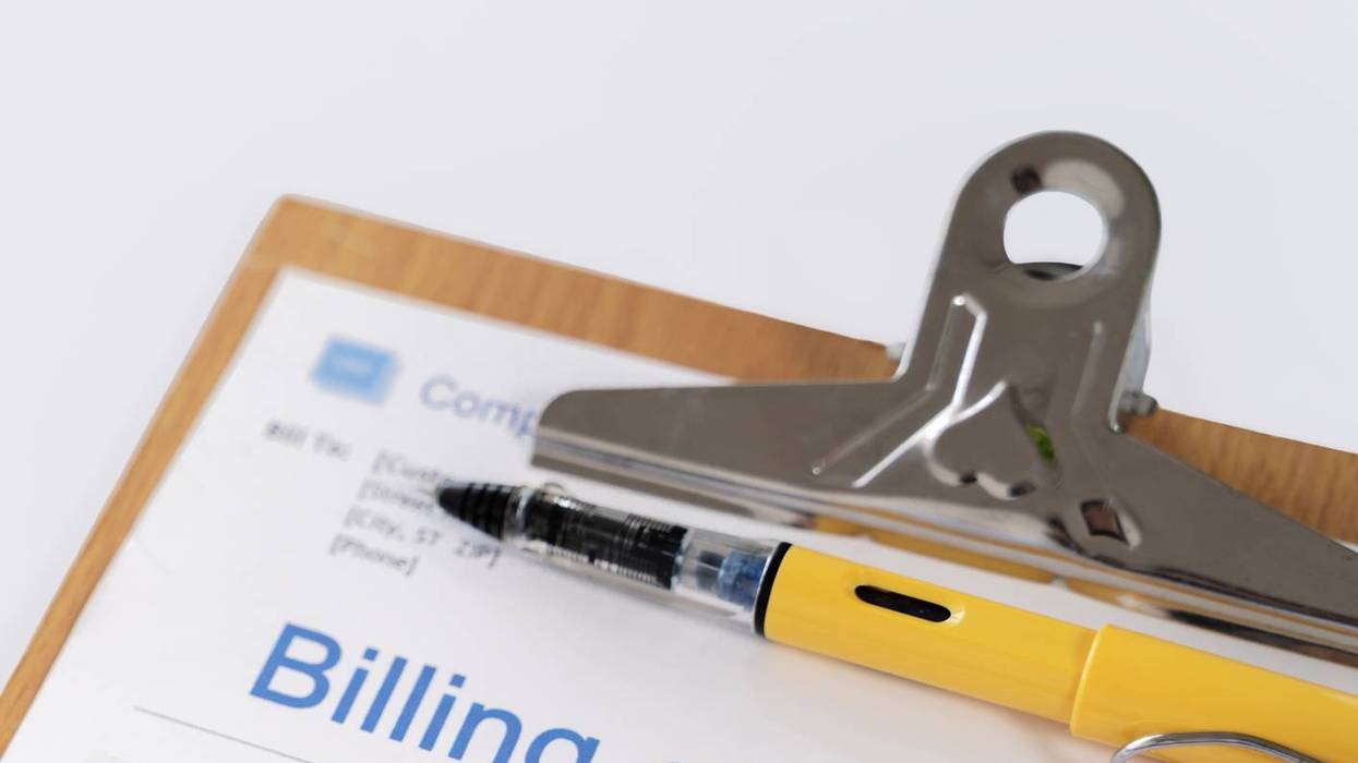 Medical Billing Statement with Pen and Stethoscope on Clipboard with Copy Space
