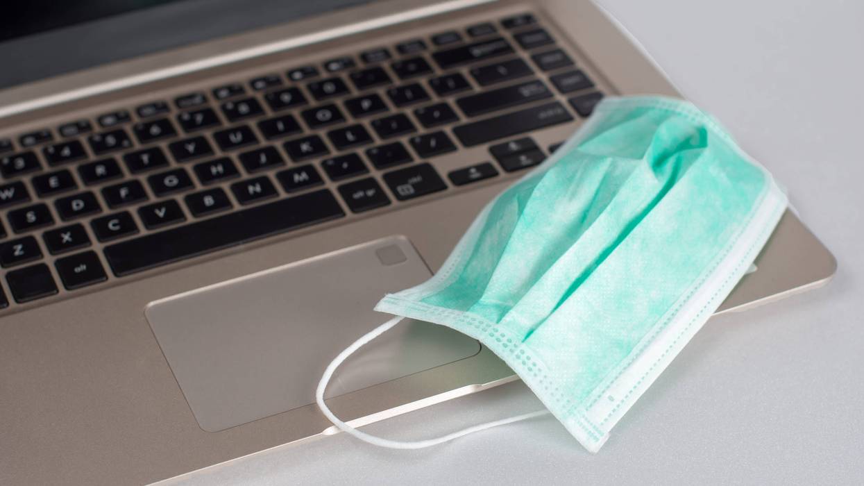 Medical breathing mask on laptop