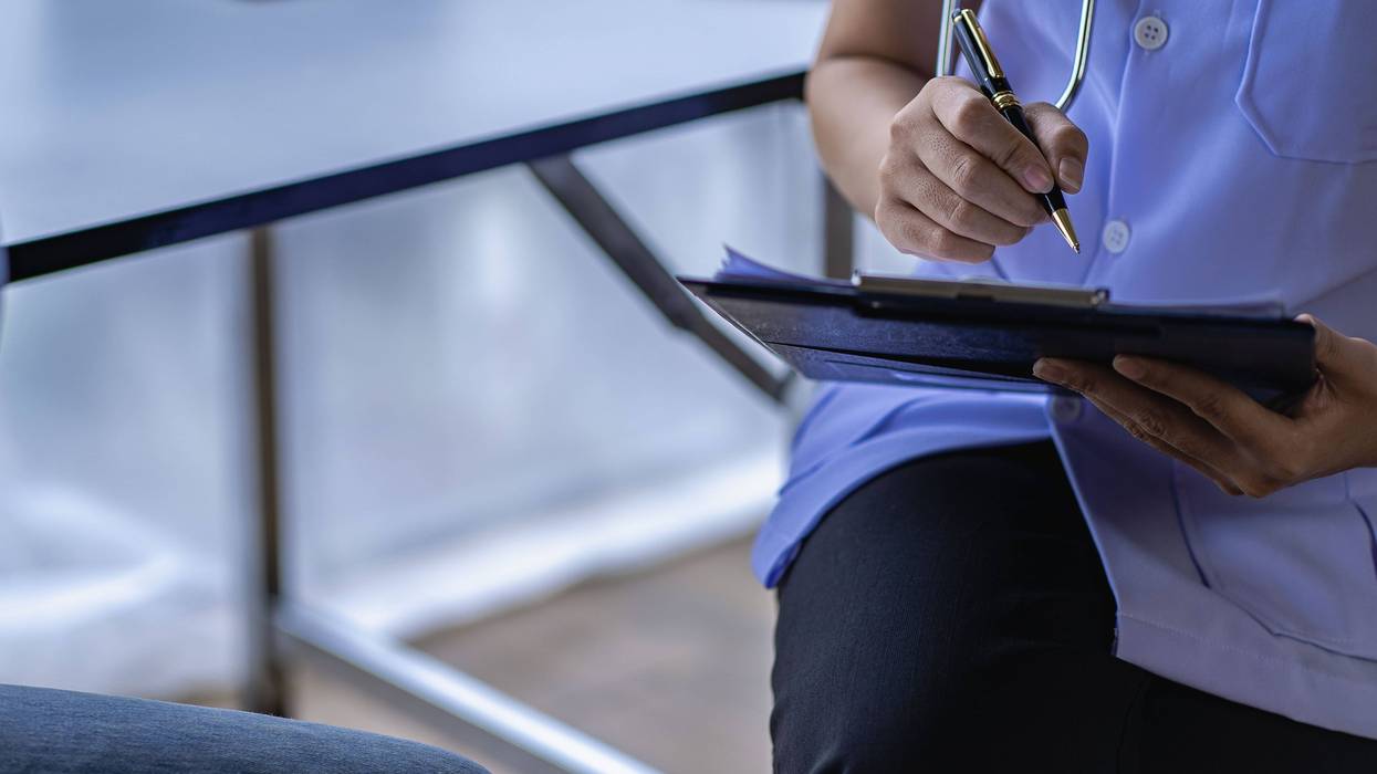 medical personnel with clipboard