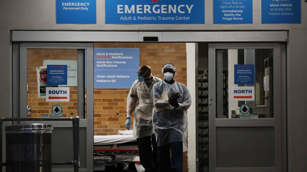 Medical workers walk outside a special coronavirus area at Maimonides Medical Center on May 26, 2020 in the Borough Park neighborhood of the Brooklyn borough of New York City.