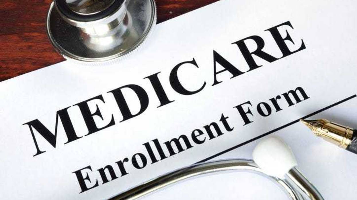 Medicare enrollment form written on a paper. Medical concept.