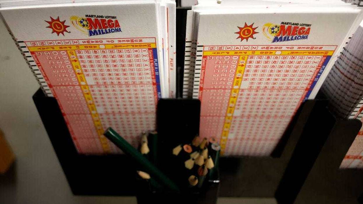 Mega Millions forms are stacked and waiting on players on August 07, 2023 in Silver Spring, Maryland. The Mega Millions jackpot is projected to reach an estimated $1.55 billion for its next drawing on Tuesday, the lottery’s largest prize ever.