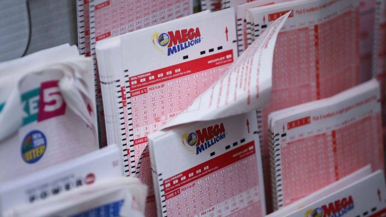 Mega Millions lottery tickets sit inside a convenience store