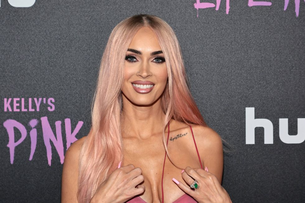 Megan Fox rocks super tight jeggings catsuit with big boots