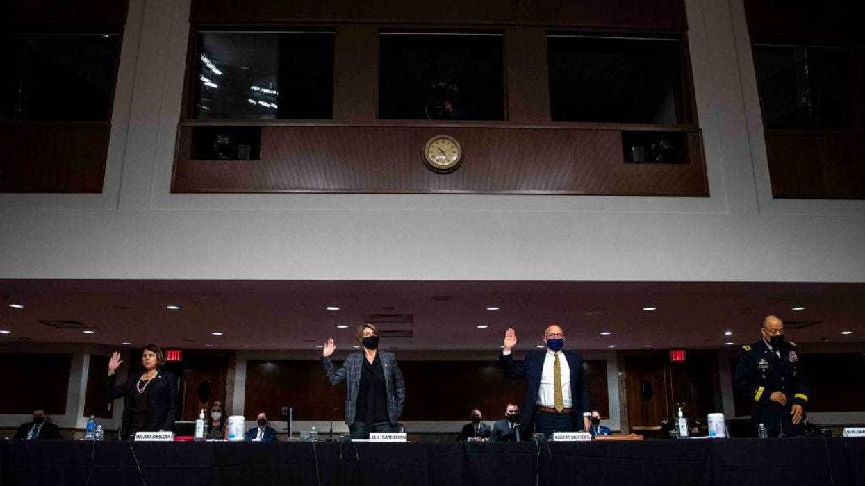 Melissa Smislova, Senior Department of Homeland Security official in the Office of Intelligence and Analysis, Jill Sanborn, Assistant Director of FBI Counterterrorism Division, Robert G. Salesses, Senior Department of Defense Official for Homeland Defense and Global Security and Major General William J. Walker, Commanding General District of Columbia National Guard, are sworn in at a Homeland Security and Governmental Affairs/Rules and Administration hearing March 3, 2021 on Capitol Hill in Washington, DC. The committee is scheduled to hear testimony about DHS, FBI, National Guard and Department of Defense support and response to the attack on the U.S. Capitol on January 6. (Photo by Shawn Thew-Pool/Getty Images)