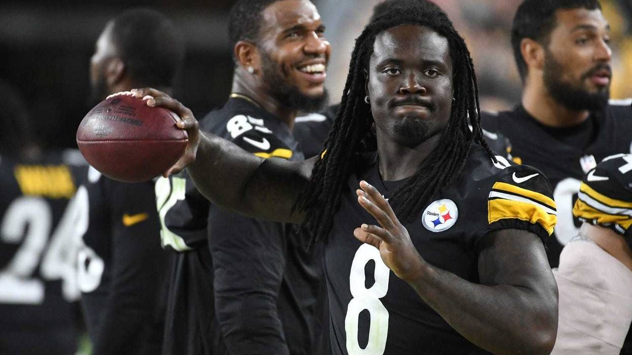 Melvin Ingram with Eric Ebron behind him