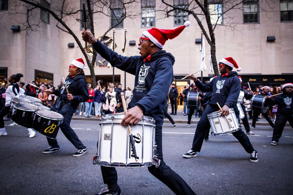 Members of a Band from Brooklyn perform by the 5th avenue during the 200th years anniversary celebration on December 8, 2024