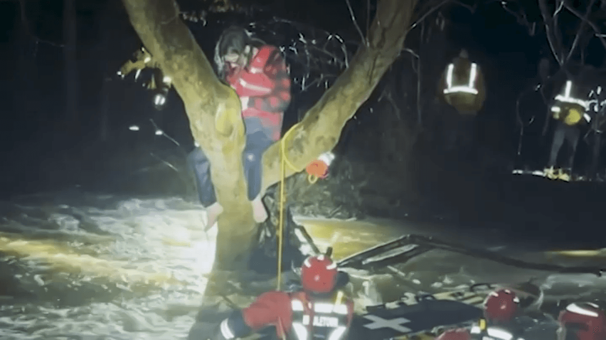 Members of Delaware County's Water Rescue Task Force save a man from floodwaters.
