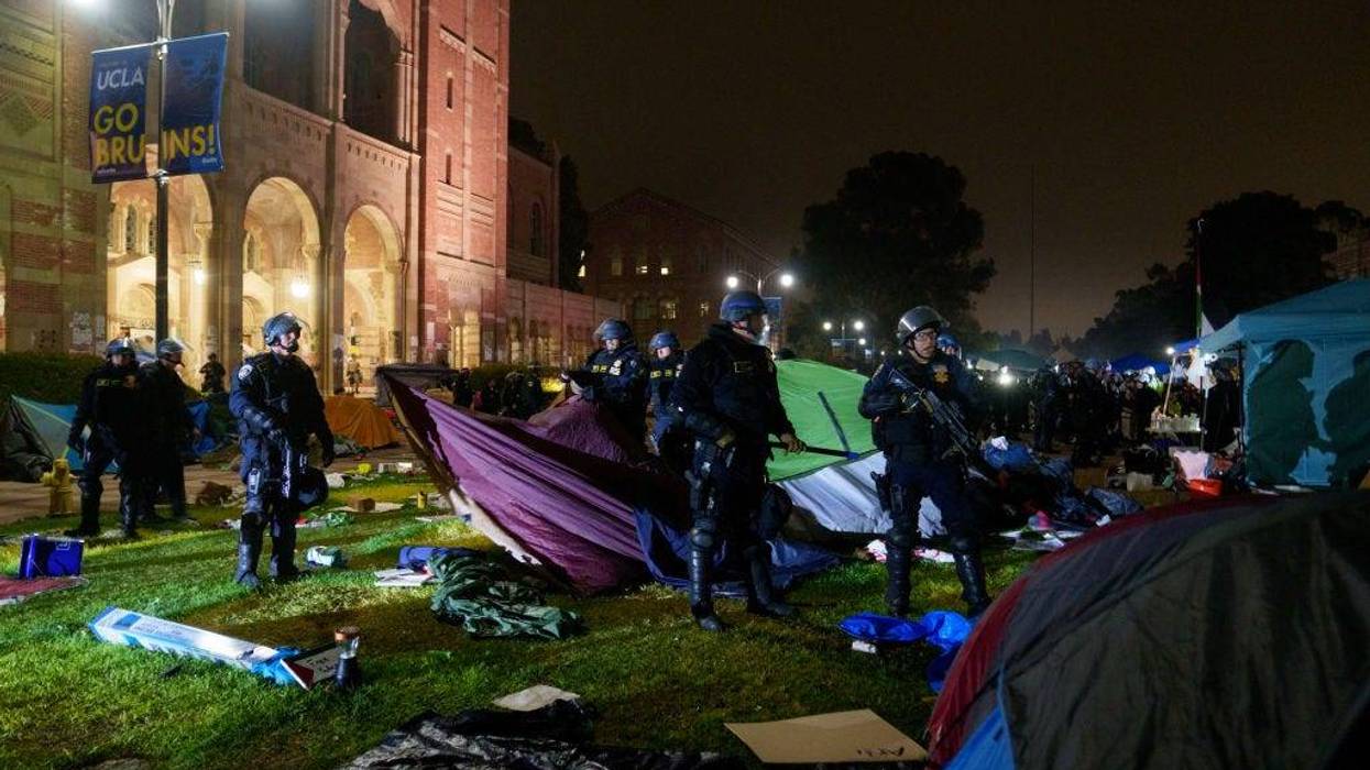 Members of law enforcement take down tents in a Pro-Palestinian encampment at UCLA on May 2, 2024 in Los Angeles, California.