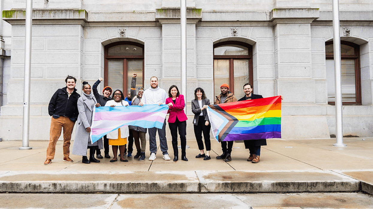 Members of Philadelphia's LGBTQ communities stand with Councilmember-at-Large Rue Landau (center, pink jacket) outside of City Hall.