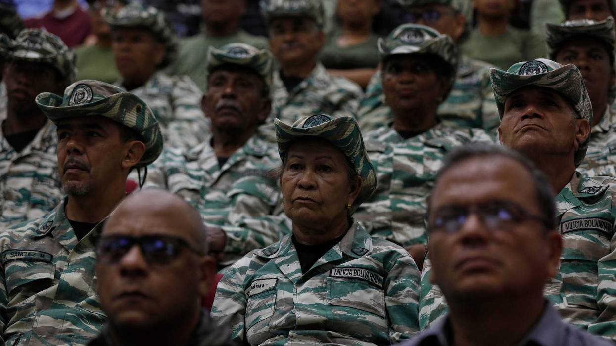 Members of the Bolivarian Militia listen to a recorded speech by President Nicolás Maduro at a military garrison in Caracas, Venezuela, Friday, Sept. 5, 2025.