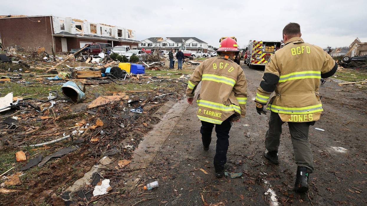 Members of the Bowling Green Fire Department worked the scene where homes were damaged near Creekwood Ave. in Bowling Green, Ky. on Dec. 11, 2021. A tornado cut a path through several states, including Kentucky, which resulted in fatalities.