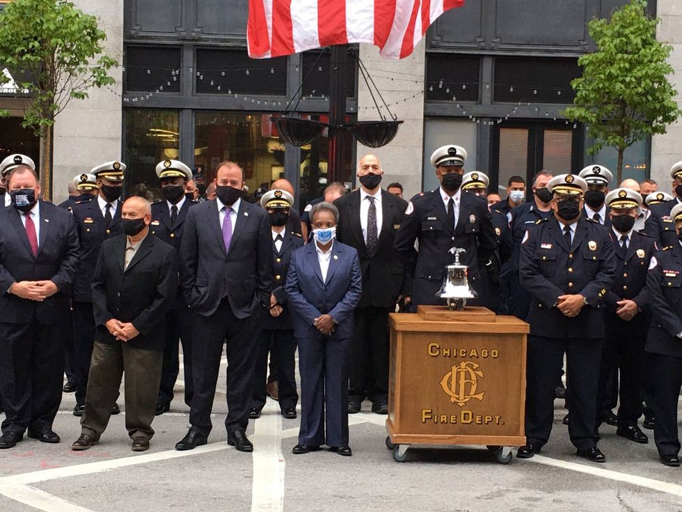 Members of the Chicago Fire Department, including some firefighters who went to New York after the 9/11 terror attacks, held a remembrance ceremony Friday in the River North neighborhood.