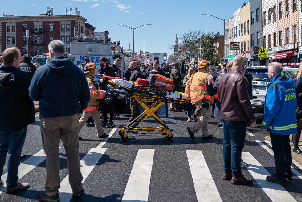 Members of the FDNY gather at the site of a shooting at the 36 St subway station on April 12, 2022 in New York City