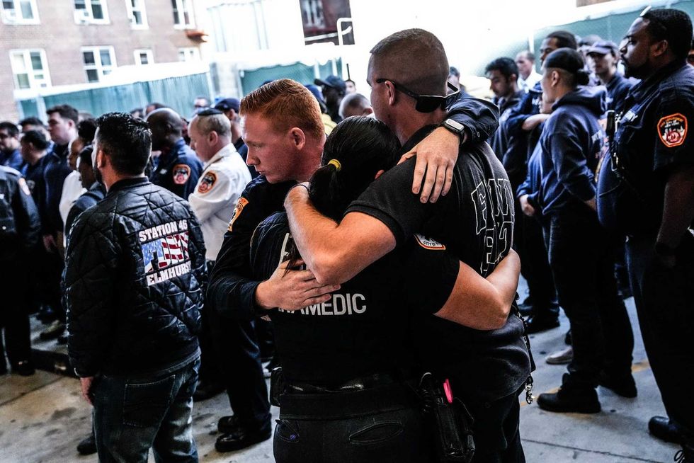 Members of the FDNY outside Mount Sinai Queens on Thursday as Mayor Eric Adams arrived