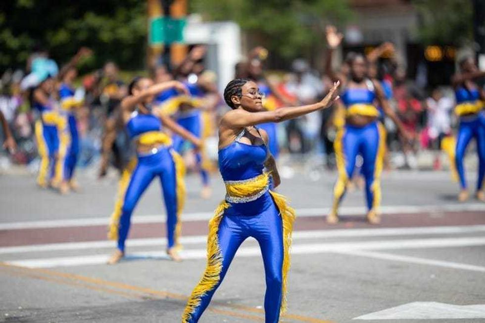 Members of the Golden Knights Drill Team performing at the Bud Billiken Parade