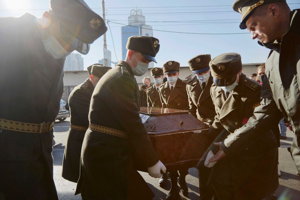 Members of the Kyiv Presidential Honor Guard Battalion carry the coffin of Captain Anton Olegovich Sidorov to the Saint Trinity Cathedral on February 22, 2022 in Kyiv, Ukraine. The soldier
