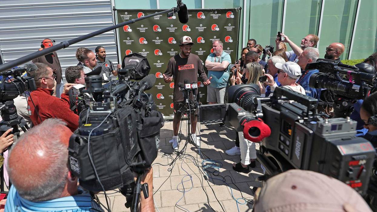 Members of the media crowd around fifth round pick Shedeur Sanders during a press conference before day two of NFL rookie minicamp at the Cleveland Browns training facility on Saturday, May 10, 2025, in Berea, Ohio.