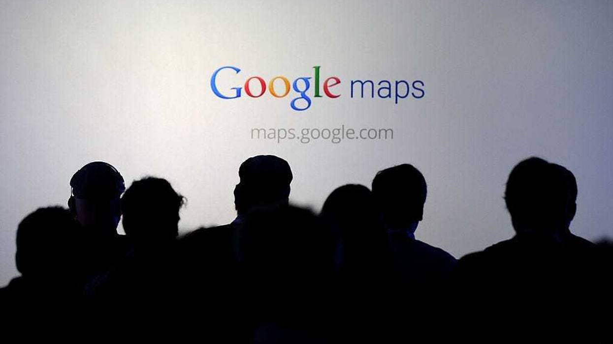 Members of the media watch a slideshow during a news conference about Google Maps on June 6, 2012 in San Francisco, California.