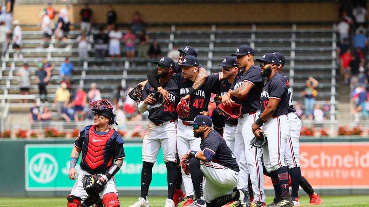Members of the Minnesota Twins pose for a photo after defeating the Kansas City Royals 7-6 at Target Field on May 30, 2024 in Minneapolis, Minnesota.