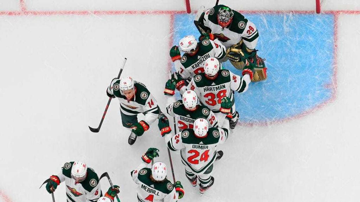 Members of the Minnesota Wild celebrate their 5-1 victory over the St. Louis Blues in Game Three of the First Round of the 2022 Stanley Cup Playoffs at Enterprise Center on May 6, 2022 in St Louis, Missouri.