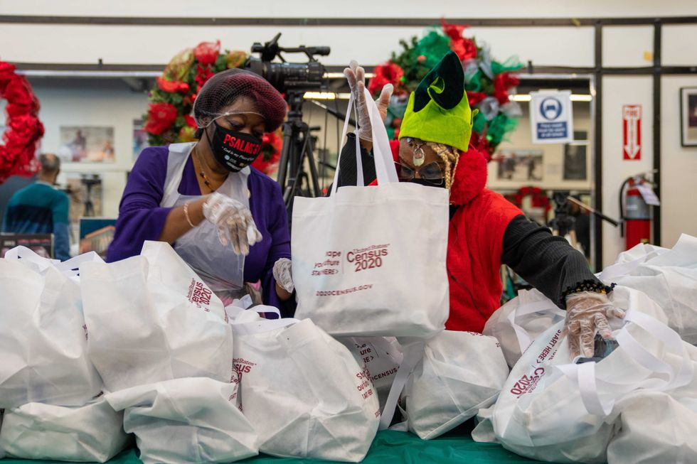Members of the National Action Network prepare meals and celebrate Christmas by feeding the community at their annual event on December 25, 2020 in New York City. Due to COVID-19 restrictions, NAN