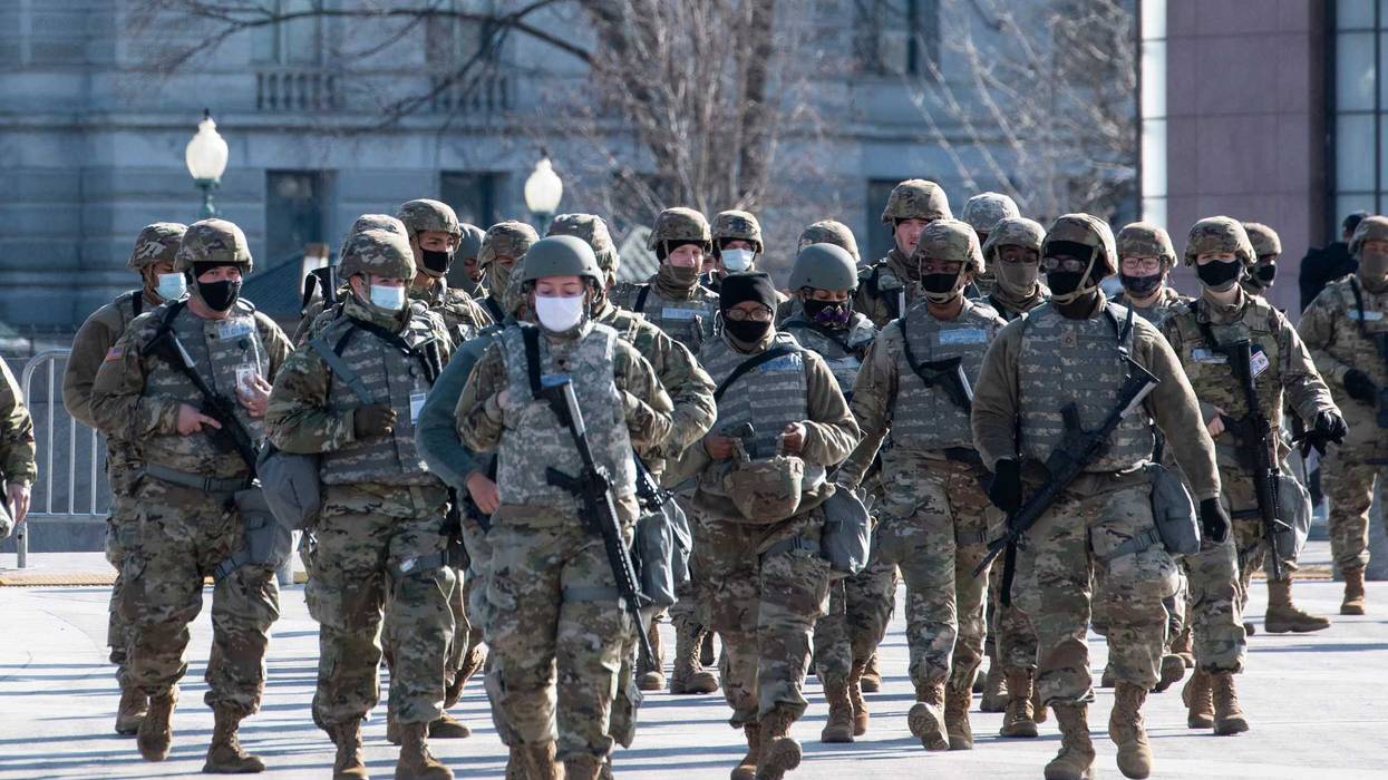 Members of the National Guard arrive as the US Capitol goes into lockdown due to a threat during the dress rehearsal for the inauguration of President-elect Joe Biden on January 18, 2021 in Washington, DC. The inauguration will take place on January 20.