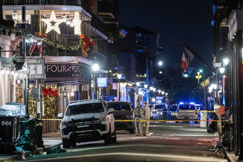 Members of the National Guard monitor a blocked off section of the French Quarter on Wednesday night