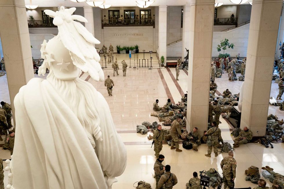Members of the National Guard rest in the Visitor Center of the U.S. Capitol on January 13, 2021 in Washington, DC. Security has been increased throughout Washington following the breach of the U.S. Capitol last Wednesday, and leading up to the Presidential inauguration.