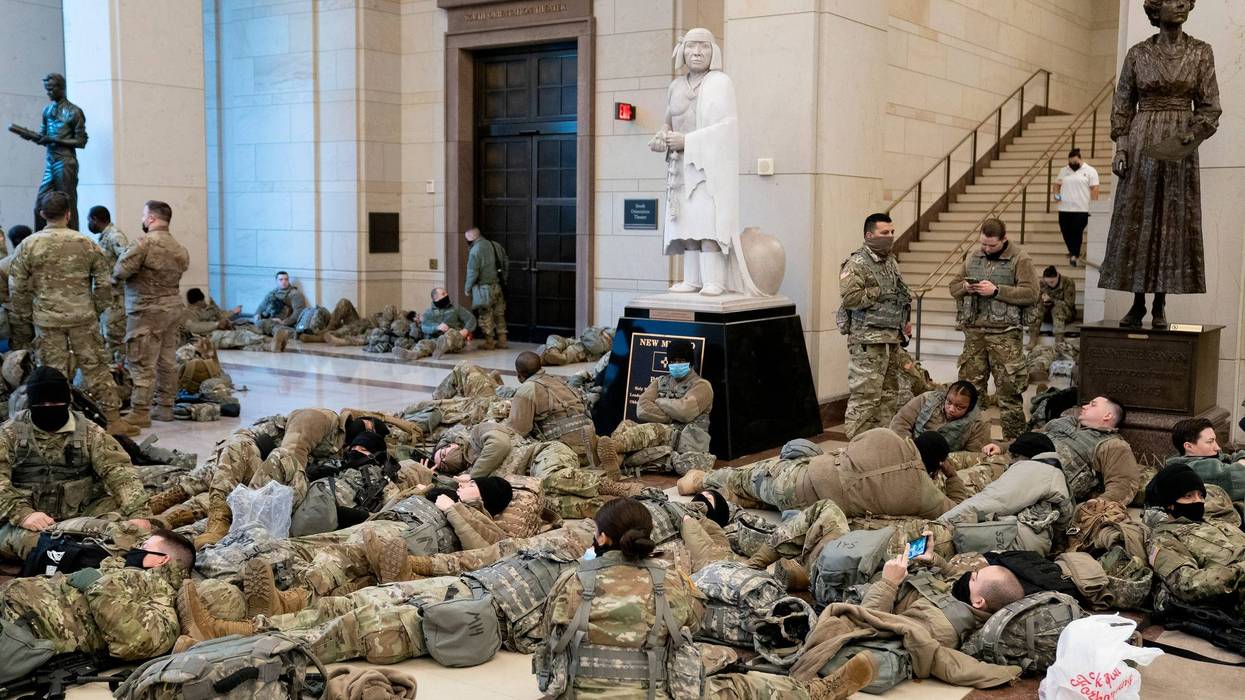 Members of the National Guard rest in the Visitor Center of the U.S. Capitol on January 13, 2021 in Washington, DC. Security has been increased throughout Washington following the breach of the U.S. Capitol last Wednesday, and leading up to the Presidential inauguration. (Photo by Stefani Reynolds/Getty Images)