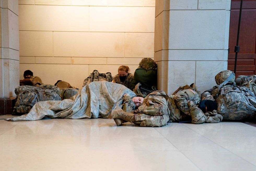 Members of the National Guard sleep on the floor of the U.S. Capitol on January 13, 2021 in Washington, DC. Security has been increased throughout Washington following the breach of the U.S. Capitol last Wednesday, and leading up to the Presidential inauguration.