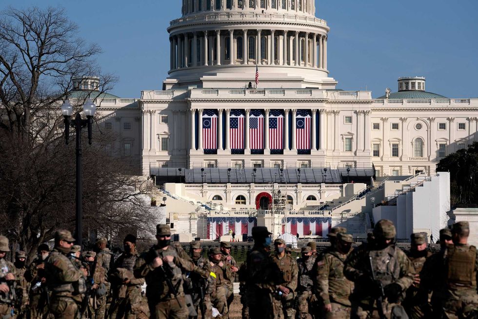 Members of the National Guard stand outside the U.S. Capitol on January 14, 2021 in Washington, DC. Security has been increased throughout Washington following the breach of the U.S. Capitol last Wednesday, and leading up to the Presidential Inauguration.