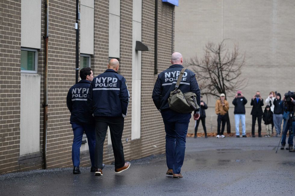 Members of the NYPD enter the Altoona Police Department on December 9, 2024 in Altoona, Pennsylvania